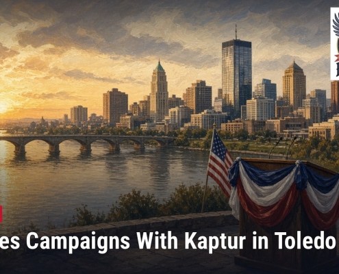Fostoria News Toledo skyline at sunset with American flags and patriotic decorations.